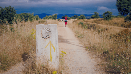 a pilgrim walking a path on the Camino del Santiago